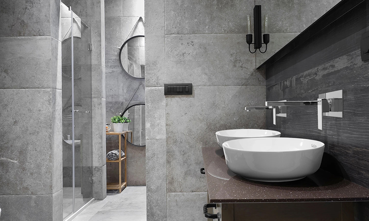 A stone tile bathroom with fittings from Cefito.